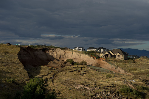 Jeremy Harmon  |  The Salt Lake Tribune

A huge scar from a landslide is seen above 739 Parkway Drive in North Salt Lake where a home was destroyed early in the morning on Tuesday, August 5, 2014.