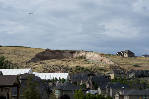 Jeremy Harmon  |  The Salt Lake Tribune

A huge scar from a landslide is seen above Parkway Drive in North Salt Lake on Tuesday, August 5, 2014.