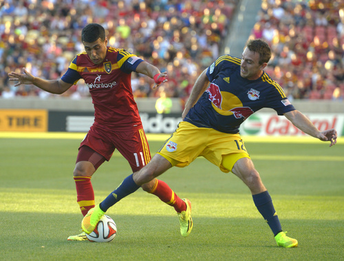 Real Salt Lake midfielder Javier Morales (11) goes after the ball, along with New York Red Bulls midfielder Eric Alexander (12), in MLS action at Rio Tinto Stadium, in Salt Lake City, Wednesday, July 30, 2014. (AP Photo/The Salt Lake Tribune, Rick Egan)