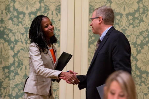 Trent Nelson  |  Tribune file photo
A new poll shows a 12-point gap in the 4th Congressional District race between Republican Mia Love and Democrat Doug Owens. The two are shown here shaking hands before a debate last May.