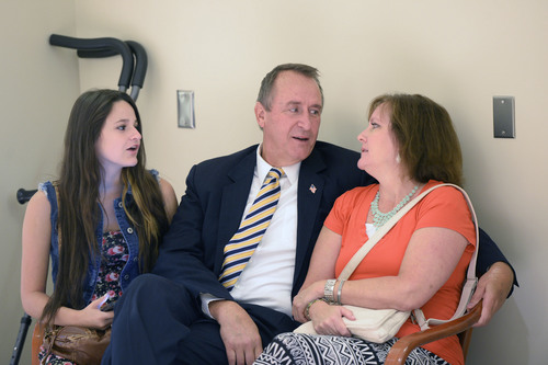 Al Hartmann  |  The Salt Lake Tribune 
Former attorney general Mark Shurtleff talks with his wife M'Liss and daughter Annie in the court hallway before making a first appeance along with former attorney general John Swallow in Judge Royal Hansen's courtroom on charges of receiving or soliciting bribes, accepting gifts, tampering with evidence, obstructing justice and participating in a pattern of unlawful conduct.
