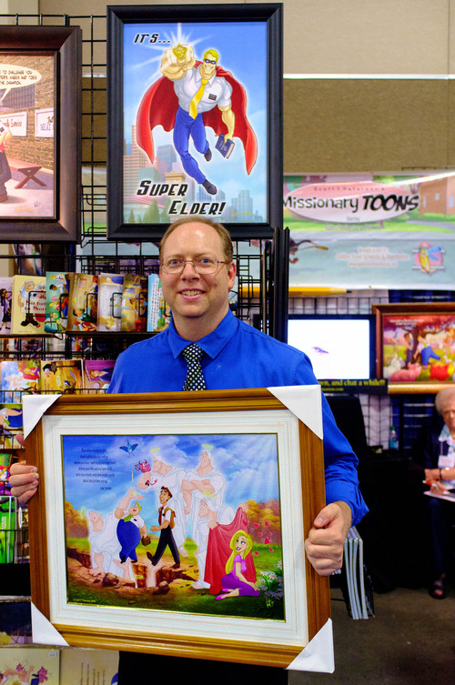 Trent Nelson  |  The Salt Lake Tribune
Artist Scott Petersen with some of his work at the Latter-day Expo, an open-to-the-public trade fair of consumer goods themed toward the LDS market, Saturday August 9, 2014 at the South Towne Expo Center in Sandy.