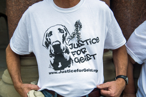 Chris Detrick  |  The Salt Lake Tribune
Shawn Gillard, of Salt Lake City, displays his shirt during a Justice for Geist rally outside of City Hall Tuesday August 12, 2014.  Salt Lake City police Officer Brett Olsen shot Geist on June 18 during a search for a missing 3-year-old boy, who was later found asleep in his own basement.