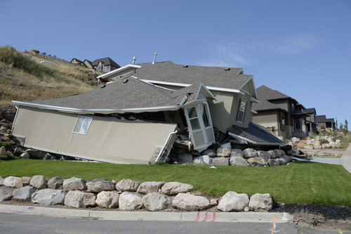 Al Hartmann  |  The Salt Lake Tribune 
A home destroyed by landslide at Parkway Drive in North Salt Lake. Residents returned to their homes Wednesday Aug. 6, 2014, a day after a landslide destroyed the home and others had to be evacuated.
