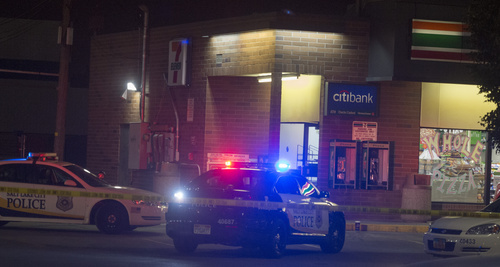 Rick Egan  |  The Salt Lake Tribune

Salt Lake police investigate a shooting at the 7-Eleven on 2100 South and State Street,  Monday, August 11, 2014