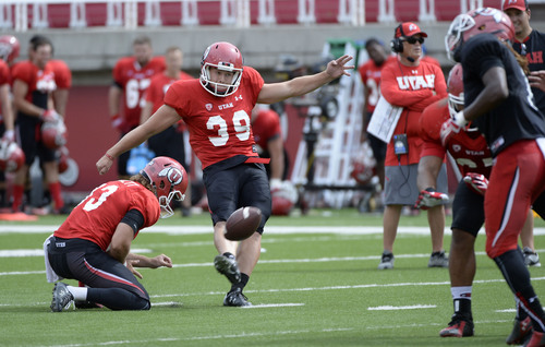 Al Hartmann  |  The Salt Lake Tribune 
Kicker Andy Phillips make an extra point kick during practice at Ute football camp Wednesday August 13, 2014.