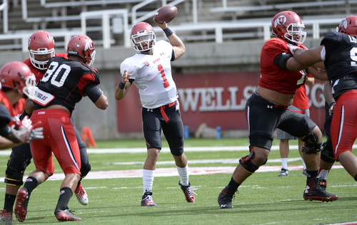 Al Hartmann  |  The Salt Lake Tribune 
Quarterback Kendall Thompson looks for open man during practice at Ute football camp Wednesday August 13, 2014.