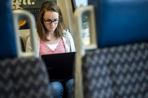 Chris Detrick  |  The Salt Lake Tribune
Autumn Long, of Ogden, uses the free Wi-Fi on her laptop while riding UTA's FrontRunner to Ogden from Salt Lake City Tuesday July 29, 2014.