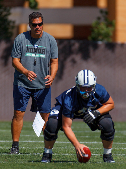 Trent Nelson  |  The Salt Lake Tribune
Offensive coordinator Robert Anae at BYU football practice in Provo Saturday August 3, 2013. Terrance Alletto at right.