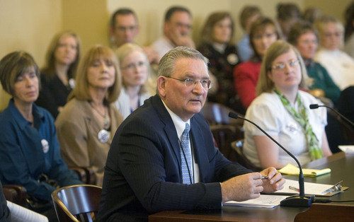 Al Hartmann   |  The Salt Lake Tribune 
Martell Menlove, then deputy superintendent of the Utah State Office of Education, speaks before the Senate Education Committee in  2011. Now superintendent, he announced his retirement Friday.