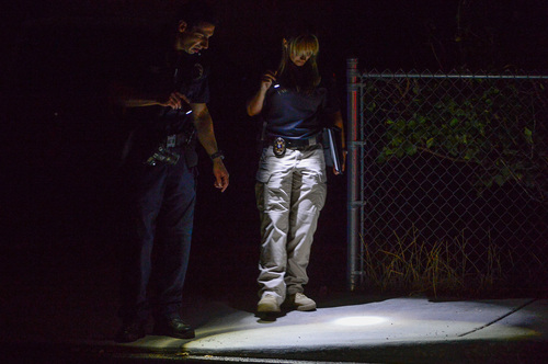 Francisco Kjolseth  |  The Salt Lake Tribune
Police search for evidence at the scene of a shooting in South Salt Lake on Thursday night at 3790 South, 200 East where one person was taken to the hospital in critical condition while 3 to 4 individuals were detained.