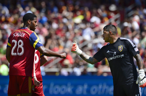 Scott Sommerdorf   |  The Salt Lake Tribune
Defenseman Chris Schuler and GK Nick Rimando bump fists after a good defensive play during first half play. RSL defeated the Seattle Sounders 2-1 at Rio Tinto Stadium, Saturday, August 15, 2014.