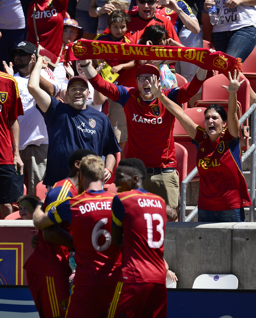 Scott Sommerdorf   |  The Salt Lake Tribune
RSL fans join in as RSL players celebrate Joao Plata's goal that gave RSL a 1-0 lead early in the second half. RSL defeated the Seattle Sounders 2-1 at Rio Tinto Stadium, Saturday, August 15, 2014.