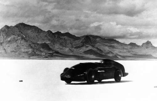 British automobile racer Sir Malcolm Campbell speeds across the salt bed in his Bluebird and sets a world record of 301.337 miles per hour on the Bonneville Salt Flats, Utah, Sept. 3, 1935.  (AP Photo)