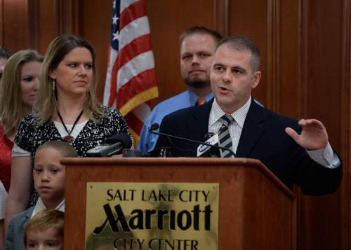 Scott Sommerdorf   |  The Salt Lake Tribune
As her father Rick Koerber speaks at a news conference, 3 year old Annastasia scans the audience during the event the day after a federal judge tossed out 18 charges against Koerber that had alleged he operated a giant Ponzi scheme through his real estate company, Friday, August 15, 2014.