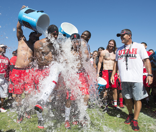 Rick Egan  |  The Salt Lake Tribune

Kenneth Scott and Dres Anderson react as ice water is poured on their heads as part of the Ice Bucket Challenge, to raise awareness for ALS, Friday, August 15, 2014