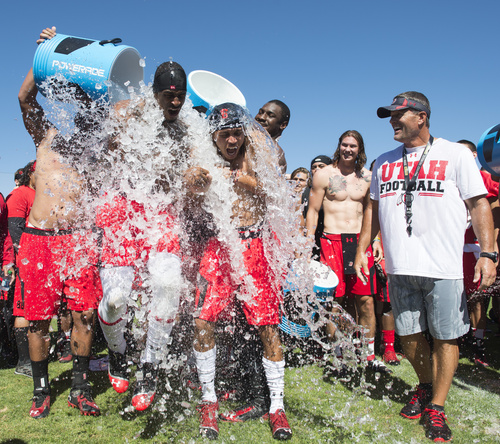 Rick Egan  |  The Salt Lake Tribune

Kenneth Scott and Dres Anderson react as ice water is poured on their heads as part of the Ice Bucket Challenge, to raise awareness for ALS, Friday, August 15, 2014