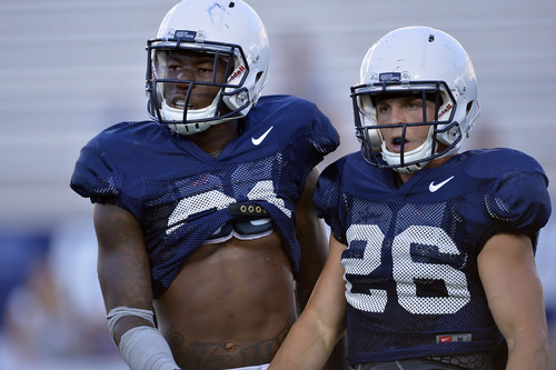Chris Detrick  |  The Salt Lake Tribune
Brigham Young Cougars running back Jamaal Williams (21) and Brigham Young Cougars Nate Carter (26) during a scrimmage at LaVell Edwards Stadium Friday August 15, 2014.