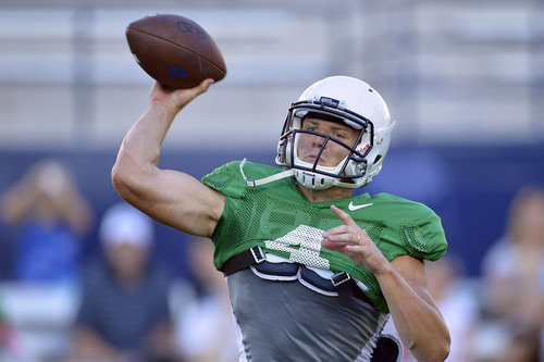 Chris Detrick  |  The Salt Lake Tribune
Brigham Young Cougars quarterback Taysom Hill (4) throws the ball during a scrimmage at LaVell Edwards Stadium Friday August 15, 2014.
