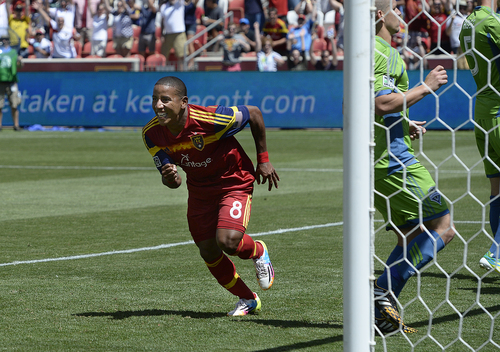 Scott Sommerdorf   |  The Salt Lake Tribune
RSL forward Joao Plata rushes to congratulate Luke Mulholland after Mulholland's shot gave RSL a 2-0 lead early in the second half. RSL defeated the Seattle Sounders 2-1 at Rio Tinto Stadium, Saturday, August 15, 2014.