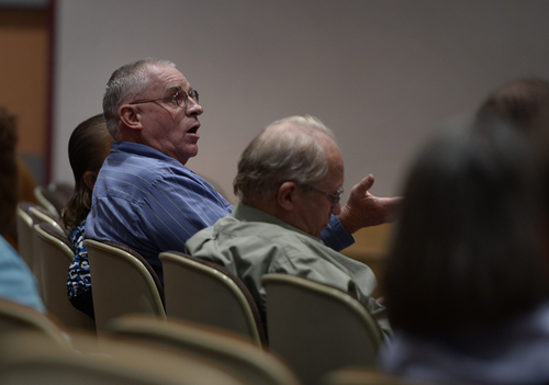 Scott Sommerdorf   |  The Salt Lake Tribune
Tom Jessop asks a question about UEP fees directed at UEP ficuciary Bruce Wisan at El Capitan School, Saturday, August 9, 2014.