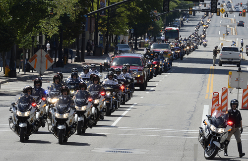 Scott Sommerdorf   |  The Salt Lake Tribune
A motorcycle ride to commemorate fallen officers stretched for miles as it headed north up State Street to the Utah State Capitol after starting at the Timpanogos Harley-Davidson dealership, Sunday, August 17, 2014.