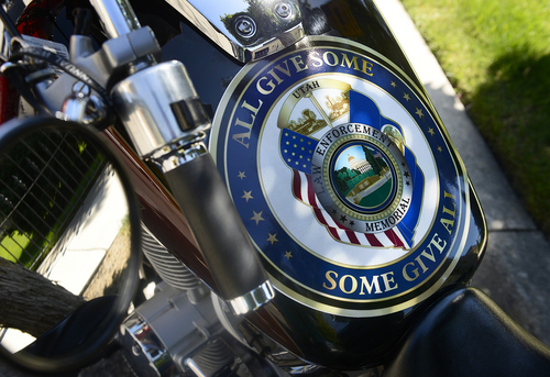 Scott Sommerdorf   |  The Salt Lake Tribune
Artwork on a motorcycle's gas tank parked at the end of a motorcycle ride to commemorate fallen officers that began at the Timpanogos Harley-Davidson dealership and ended at the Utah State Capitol, Sunday, August 17, 2014.