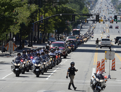 Scott Sommerdorf   |  The Salt Lake Tribune
A motorcycle ride to commemorate fallen officers stretched for miles as it headed north up State Street after having begun at the Timpanogos Harley and rides to the Utah State Capitol, Sunday, August 17, 2014.