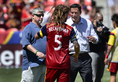 Scott Sommerdorf   |  The Salt Lake Tribune
ESL coach Jeff Casar greets Kyle Beckerman after the final whistle on the field as Seattle coach Sigi Schmid walks by at left. RSL defeated the Seattle Sounders 2-1 at Rio Tinto Stadium, Saturday, August 15, 2014.