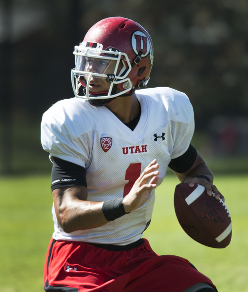 Steve Griffin  |  The Salt Lake Tribune


University of Utah quarterback Kendal Thompson drops back to throw during football practice on the University of Utah baseball field in Salt Lake City, Monday, August 18, 2014.