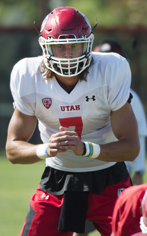 Steve Griffin  |  The Salt Lake Tribune


University of Utah quarterback Travis Wilson runs a play during football practice on the University of Utah baseball field in Salt Lake City, Monday, August 18, 2014.