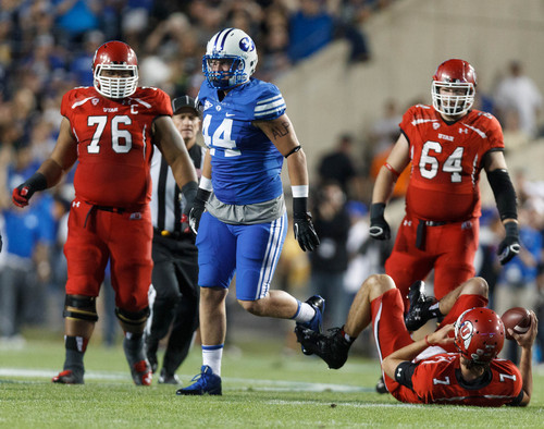 Trent Nelson  |  The Salt Lake Tribune
Brigham Young Cougars defensive lineman Remington Peck (44) celebrates sacking Utah Utes quarterback Travis Wilson (7) in the first quarter as the BYU Cougars host the Utah Utes, college football Saturday, September 21, 2013 at LaVell Edwards Stadium in Provo.