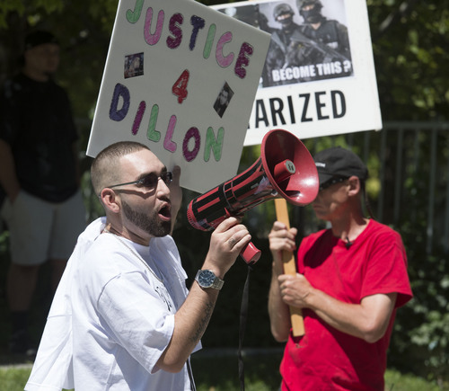 Steve Griffin  |  The Salt Lake Tribune


Aaron Swanenberg speaks through a blow horn during a protest about the police shooting of Dillon Taylor in Salt Lake City, Monday, August 18, 2014. Swananberg was a family friend of Taylor's.
