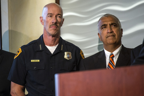 Chris Detrick  |  The Salt Lake Tribune
Salt Lake Police Chief Chris Burbank and Salt Lake County District Attorney Sim Gill listen as FBI Director James Comey speaks during a press conference at the FBI Field Office in Salt Lake City Tuesday August 19, 2014.