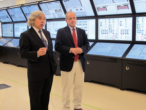 U.S. Energy Secretary Ernest Moniz, left, and U.S. Sen. Jim Risch, R-Idaho, talk about Idaho's nuclear research efforts at the Idaho National Laboratory in Idaho Falls on Wednesday, August 20, 2014. Moniz spoke at the inaugural Intermountain Energy Summit. Moniz says the United States isn't shunning coal or oil energy sources, but instead, officials are finding ways to reduce their carbon emissions. (AP Photo/Kimberlee Kruesi)