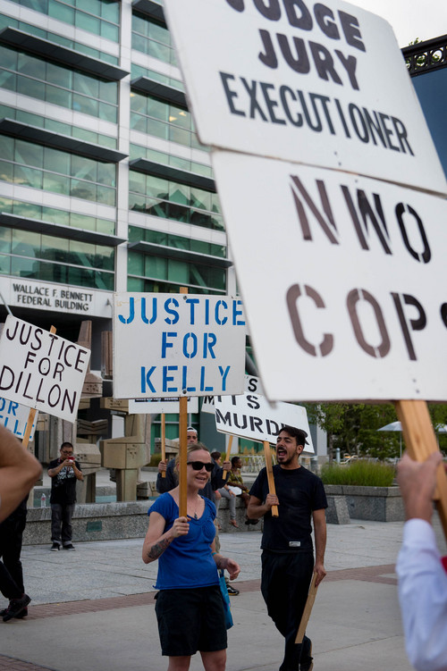 Trent Nelson  |  The Salt Lake Tribune
Protesters chant during a rally against police shootings, "Hands Up Don't Shoot," calling for justice for Dillon Taylor and Mike Brown, at the Federal Building in Salt Lake City, Wednesday August 20, 2014.
