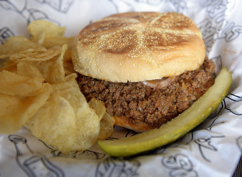 Al Hartmann  |  The Salt Lake Tribune 
Even Stevens' Sloppy Joe with beef and chrorizo, slow simmered in "slopp" sauce, pickled red onion on a Kaiser roll with chips and dill pickle.