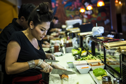 Chris Detrick  |  The Salt Lake Tribune
Mai Nguyen makes sushi at Sapa Sushi Bar & Grill in Salt Lake City on Wednesday, Aug. 13, 2014.  Nguyen was recently named Woman Business Owner of the Year by the Salt Lake chapter of the National Association of Women Business Owners. Nguyen and her family own four Salt Lake County restaurants: Sapa Sushi Bar, Bucket O'Crawfish, Fat Fish and Noodle and Chop Stick.