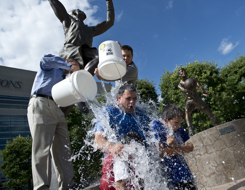 Lennie Mahler  |  The Salt Lake Tribune
Jazz fans Ari Bishon, with sons, Moroni and Riley, participate in the "ALS Ice Bucket Challenge" to raise awareness and funds to treat the disease. Karl Malone challenged all Jazz fans Wednesday night on social media.