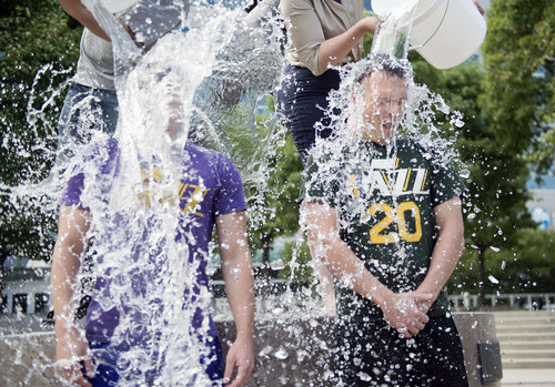 Lennie Mahler  |  The Salt Lake Tribune
Jazz fans Sean Lamb and Taylor Foulger complete the "ALS Ice Bucket Challenge" to raise awareness and funds to treat the disease. Karl Malone challenged all Jazz fans Wednesday night on social media.