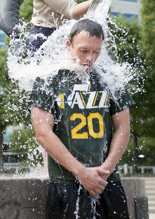 Lennie Mahler  |  The Salt Lake Tribune
Jazz fan Taylor Foulger completes the "ALS Ice Bucket Challenge" to raise awareness and funds to treat the disease. Karl Malone challenged all Jazz fans Wednesday night on social media.