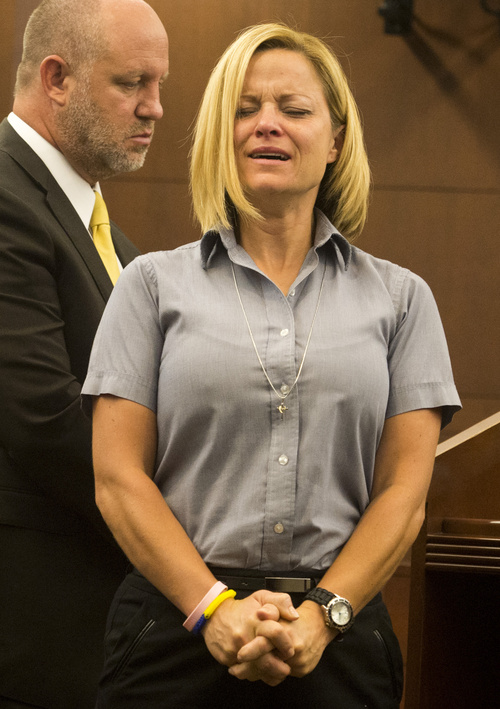 Rick Egan  |  The Salt Lake Tribune
Dea Millerberg makes a statement in Second District Court during her sentencing in Ogden, Utah, Thursday, August 21, 2014. Millerberg pleaded guilty to helping hide the body of her teen babysitter who overdosed on drugs at her house.  Attorney Michael D. Bouwhuis is on the left.