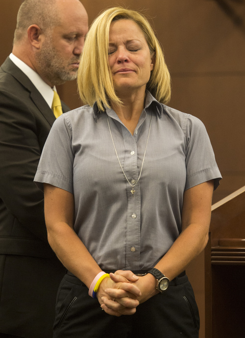 Rick Egan  |  The Salt Lake Tribune
Dea Millerberg makes a statement in Second District Court during her sentencing in Ogden, Utah, Thursday, August 21, 2014. Millerberg pleaded guilty to helping hide the body of her teen babysitter who overdosed on drugs at her house.  Attorney Michael D. Bouwhuis is on the left.