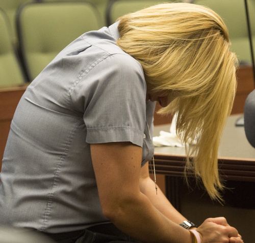 Rick Egan  |  The Salt Lake Tribune
Dea Millerberg reacts as Alexis Rasmussen's mother, Dawn Miera, makes a statement in Second District Court in Ogden, Thursday, August 21, 2014. Millerberg pleaded guilty to helping hide the body of her teen babysitter, Alexis Rasmussen, who overdosed on drugs at her house.