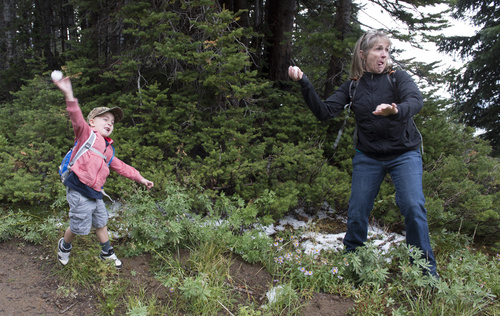 Rick Egan  |  The Salt Lake Tribune
Five-year-old Brodey Ferguson throws snowballs at his dad, along with his grandma, Debbie Ferguson, Heber City, while taking a hike near Guardsman Pass on Saturday.