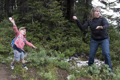 Rick Egan  |  The Salt Lake Tribune

Five-year-old Brodey Ferguson throws snowballs at his dad, along with his grandma, Debbie Ferguson, Heber City, while taking a hike near Guardsman Pass, Saturday, August 23, 2014