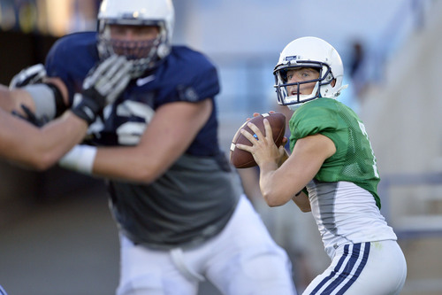 Chris Detrick  |  The Salt Lake Tribune
Brigham Young Cougars quarterback Christian Stewart (7) looks to pass the ball during a scrimmage at LaVell Edwards Stadium Friday August 15, 2014.