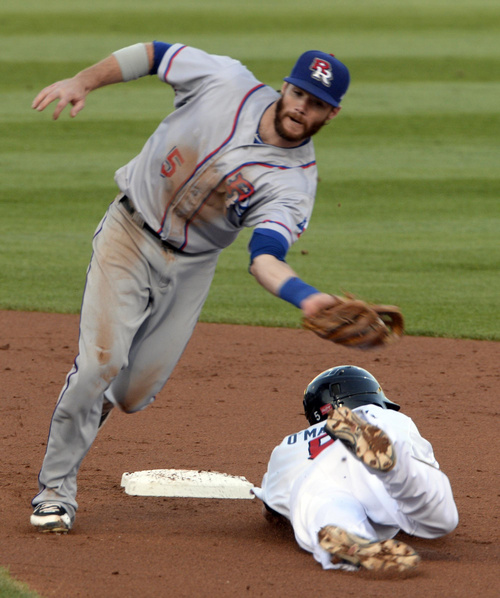 Rick Egan  |  The Salt Lake Tribune

The Bees' Shawn O'Malley slides safely into second  as Round Rock Express second baseman Jason Donald attempts the tag, as The Salt Lake Bees play The Texas Round Rock Express in PCL action at Smith's Ball Park, Saturday, August 23, 2014