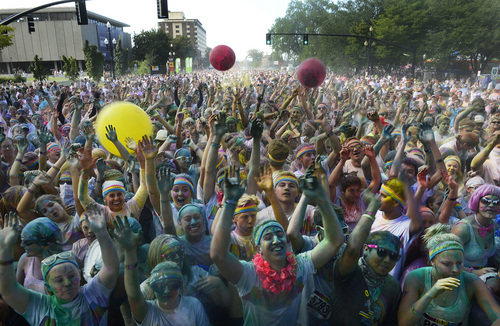 Scott Sommerdorf   |  The Salt Lake Tribune
After the Color Run was over, runners danced and threw colors in Library Square, Saturday, August 23, 2014.