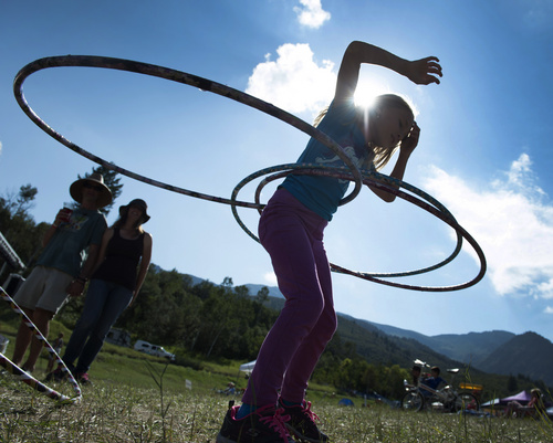Rick Egan  |  The Salt Lake Tribune

Anika Ballard, 7, Ogden, keeps three hula hoops going at the 2nd Annual Ogden Valley Roots & Blues Festival at Cutler Flats in Liberty on Sunday, August 24, 2014.